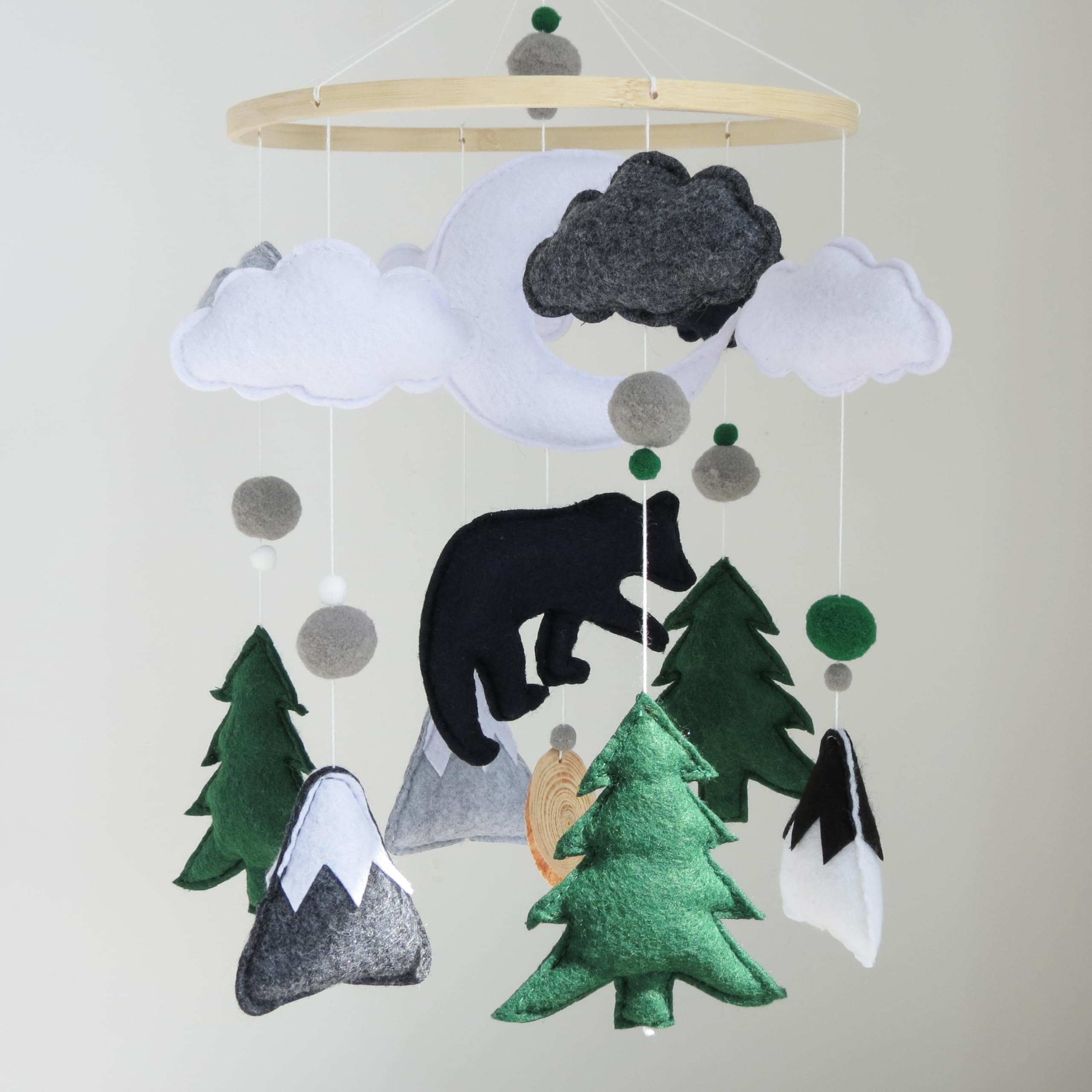 Goukurlsma minimalist woodland crib mobile complements modern nursery decor.