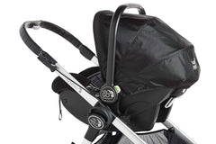 Graco infant seat mounted via Baby Jogger adapter demonstrates portable travel system.