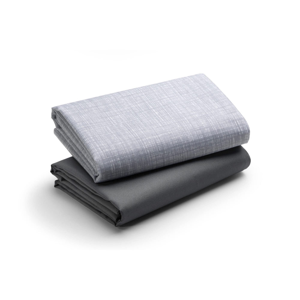 Graco Pack 'n Play waterproof sheets closeup showing soft woven grey fabric for comfy naps
