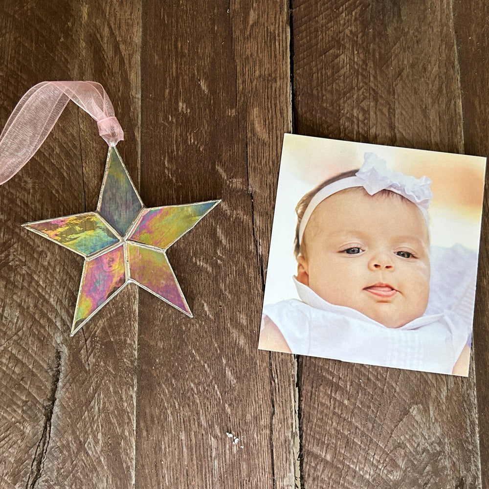 The Grandparent Gift Co nursery display idea with hanging star and pastel ambiance.