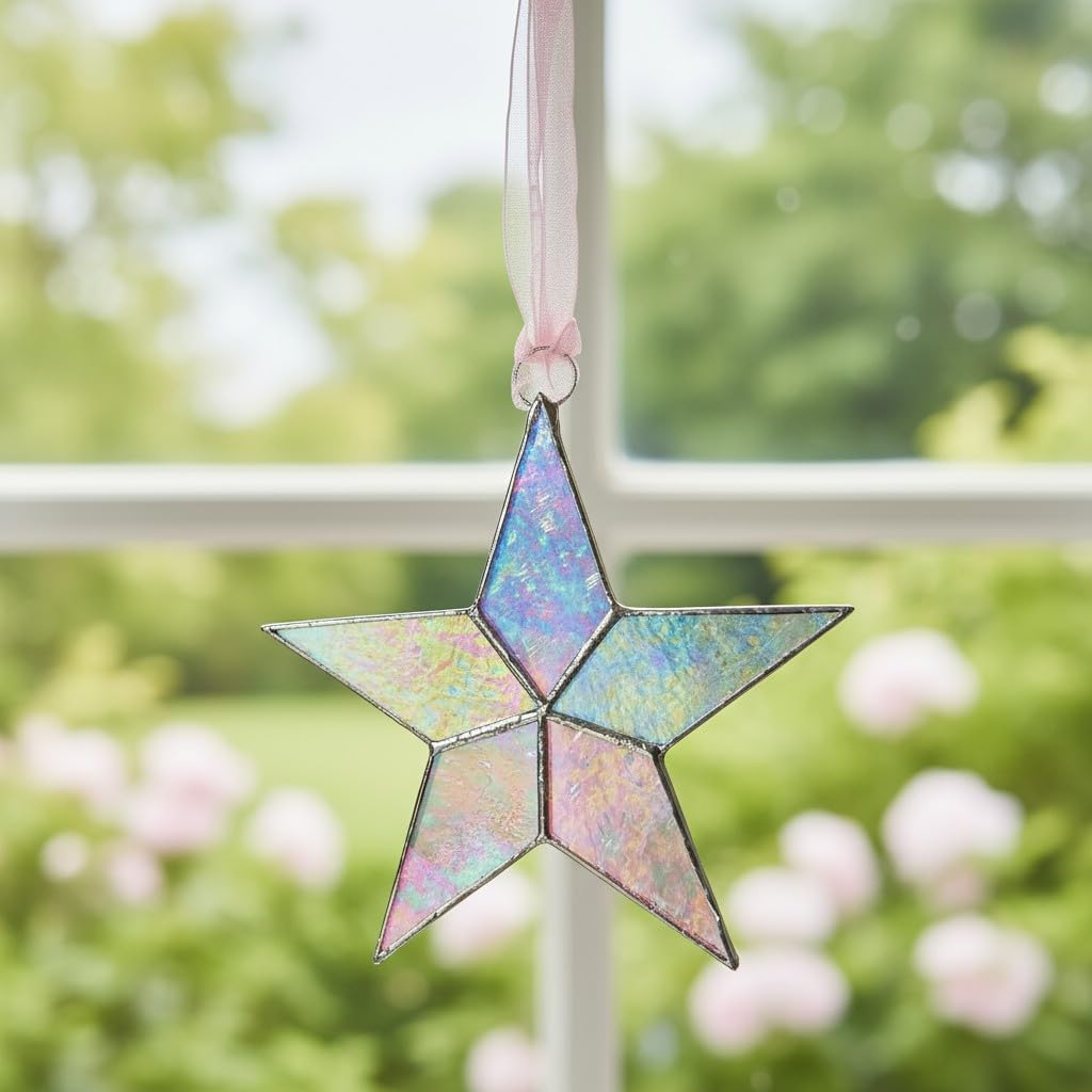 The Grandparent Gift Co pink organza ribbon star ready to hang in a nursery.