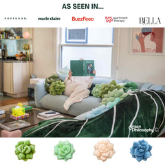 Green Philosophy Co. Succulent Pillow 20-inch on bed shows layered petals and bold decor.