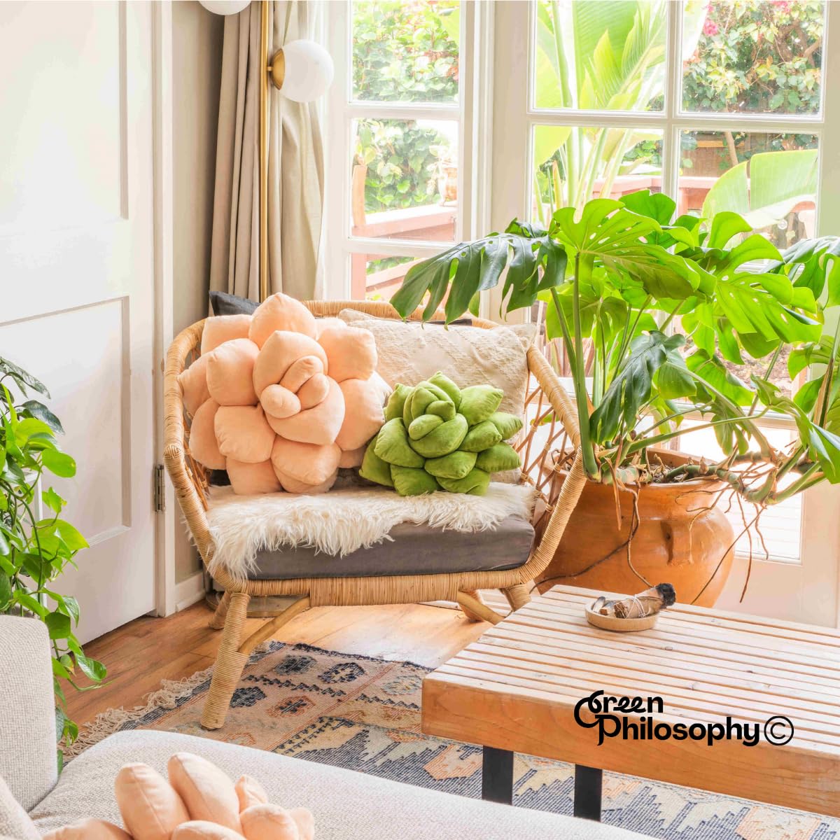 Green Philosophy Co. Succulent Pillow on floor for reading nook and play spaces.