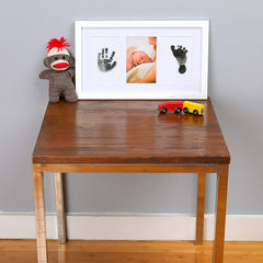 Green Pollywog archival paper sheets arranged for newborn prints.