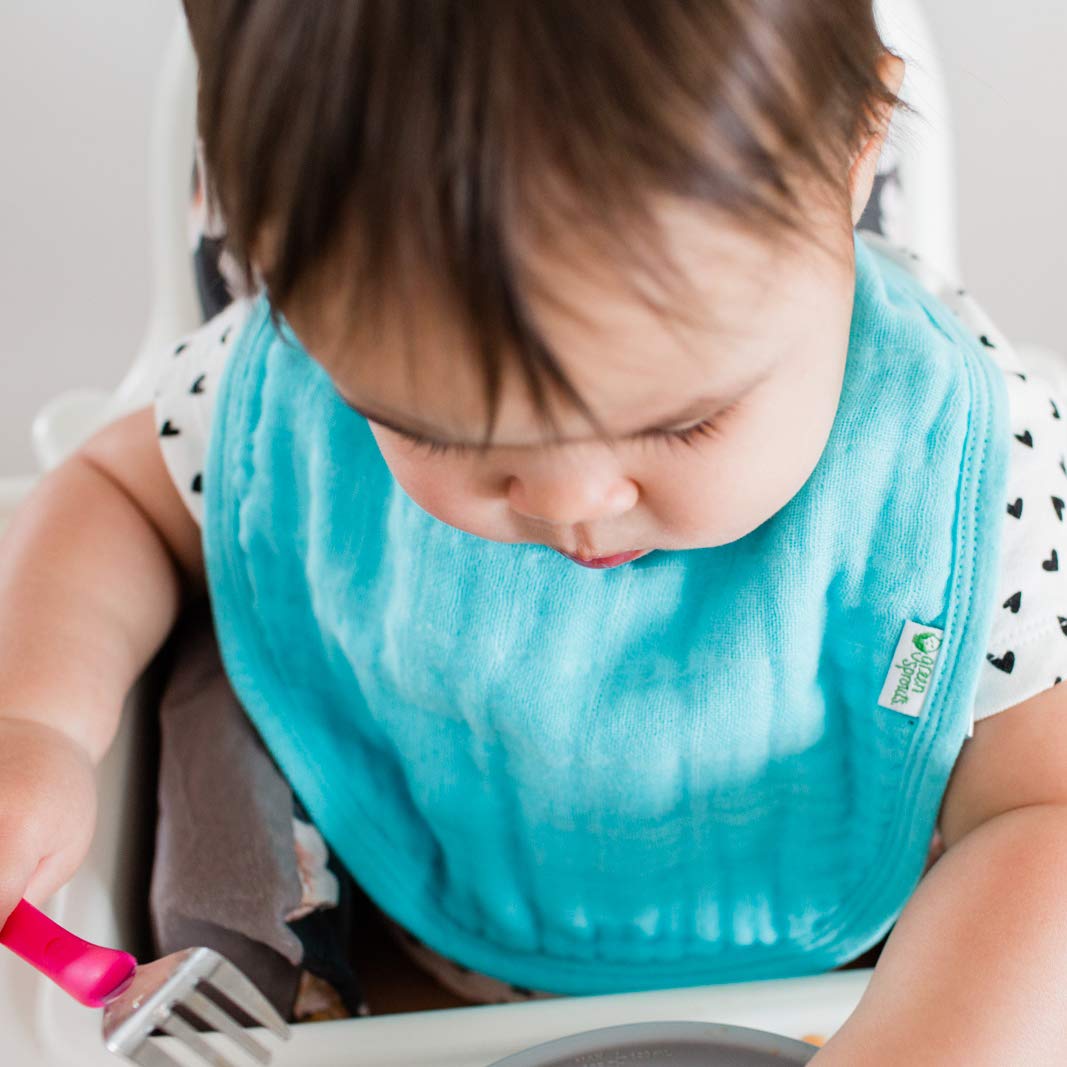 Green Sprouts baby-dry-protection bib helps catch drips and drools daily.