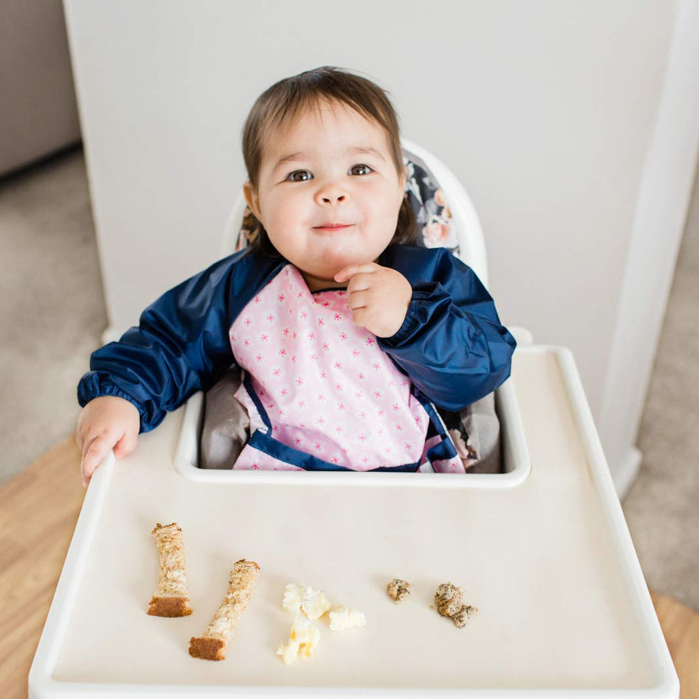 Green Sprouts Easy-Wear Long Sleeve Bib supports multi-use activities beyond meals.