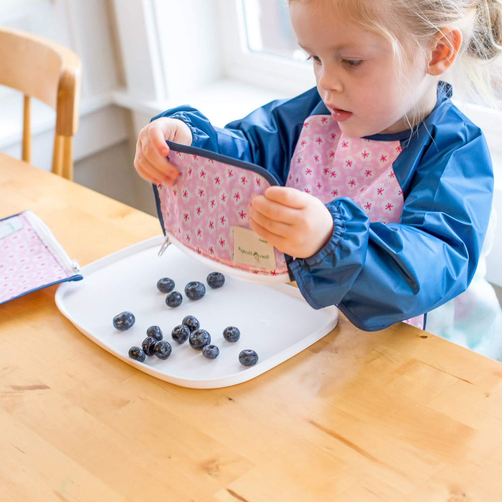 Green Sprouts Easy-Wear Long Sleeve Bib machine washable for easy cleanup.