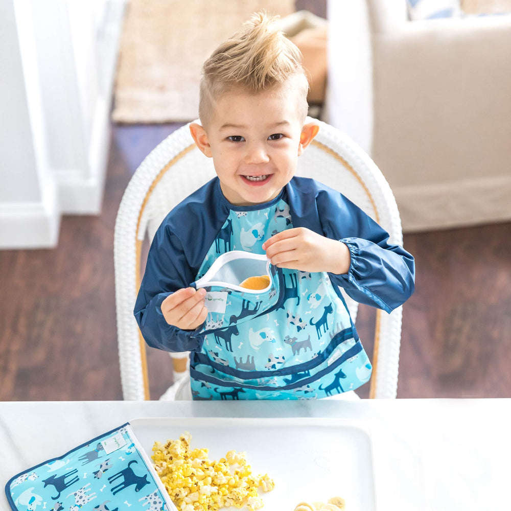 Green Sprouts Easy-Wear Long Sleeve Bib demonstrates waterproof protection to keep outfits clean.
