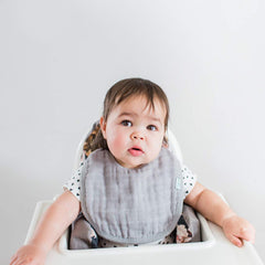 Green Sprouts organic cotton muslin bib offers gentle skin contact.