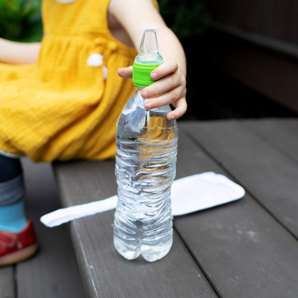 Green Sprouts Spout Adapter in use on a standard bottle for toddler-friendly hydration.