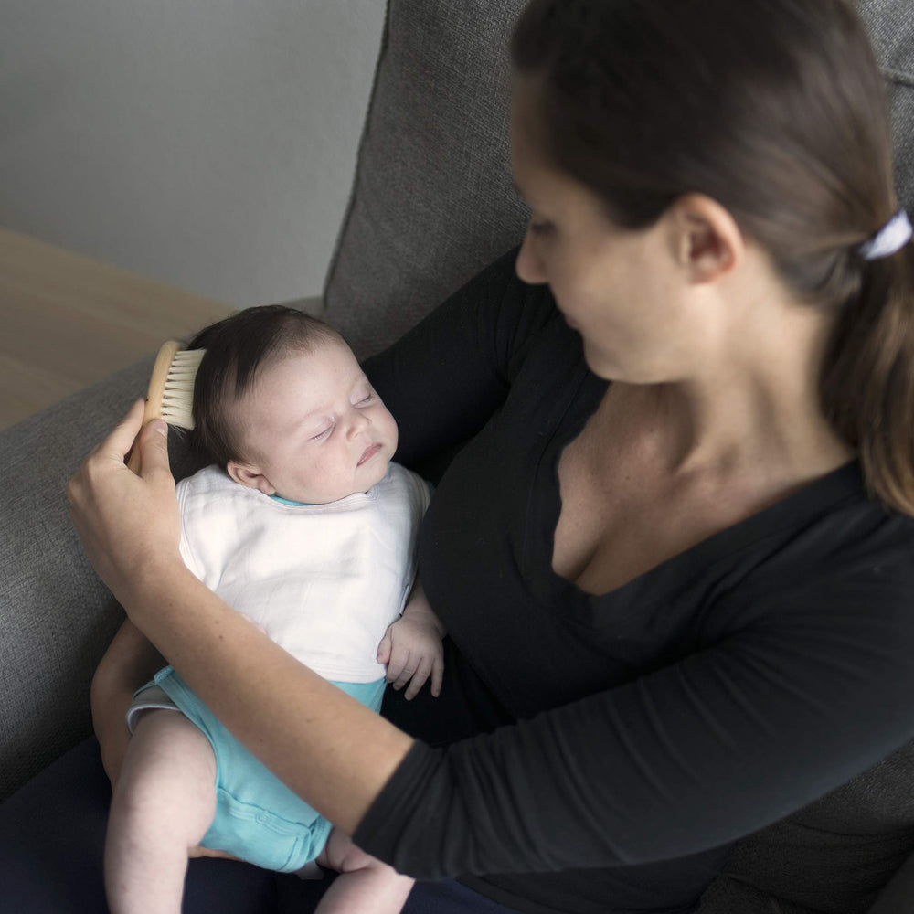 Green Sprouts Muslin Bibs four-layer protection keeps baby dry during drips.