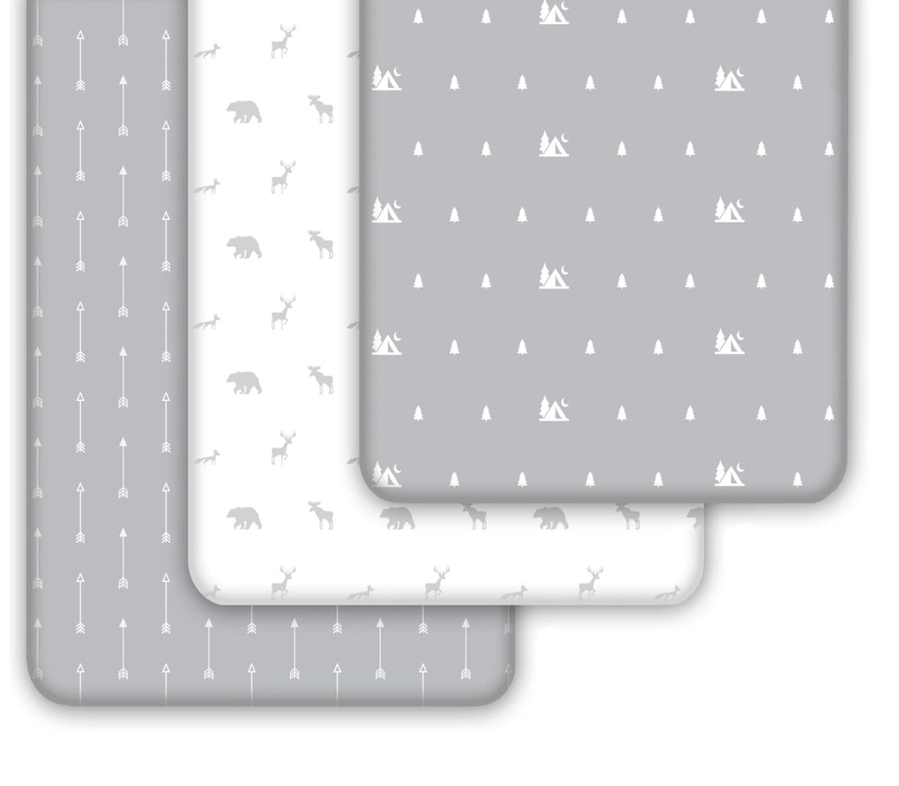 Grow Wild Woodland Gray White crib sheets laid on crib mattress to show fit.