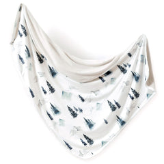 GRSSDER forest pattern baby blanket close-up highlights ultra-soft jersey knit for cozy swaddling