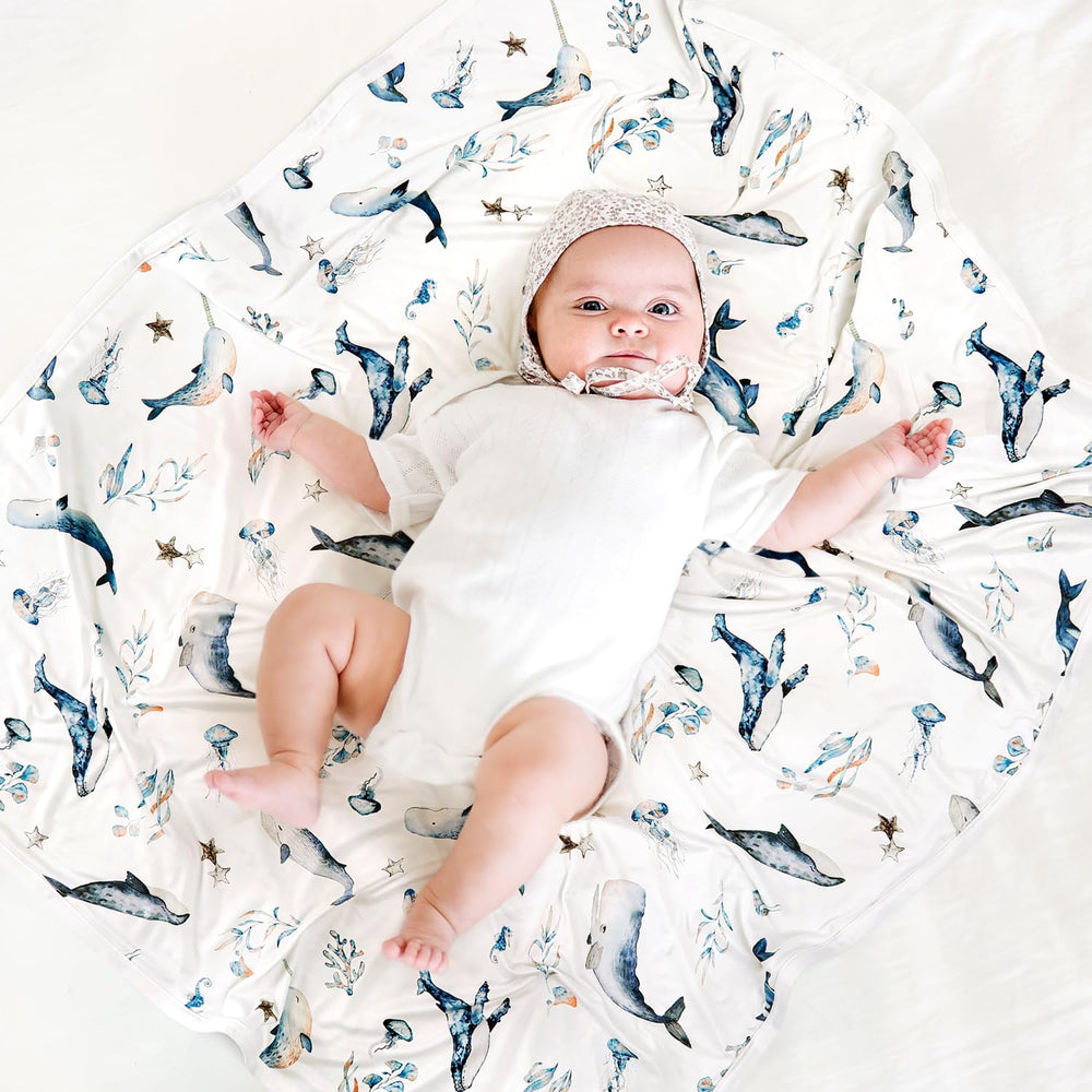 GRSSDER baby blanket in nursery decor setup complements modern nursery design.