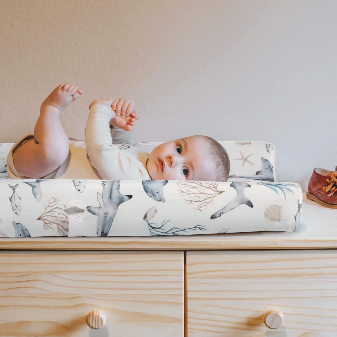 GRSSDER changing pad cover in nursery demonstrates universal fit on standard pads
