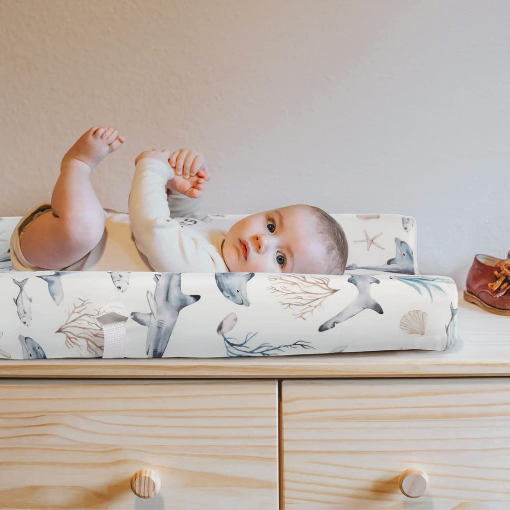 GRSSDER changing pad cover in nursery demonstrates universal fit on standard pads