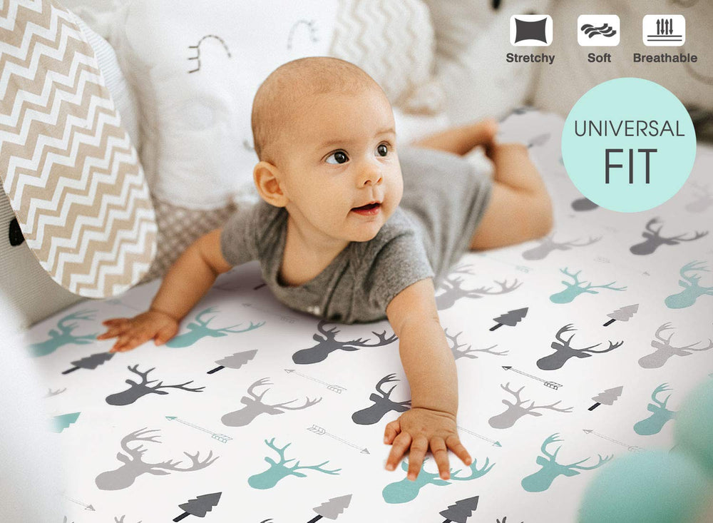 GRSSDER crib sheet with elastic edge shown stretched securely around mattress.