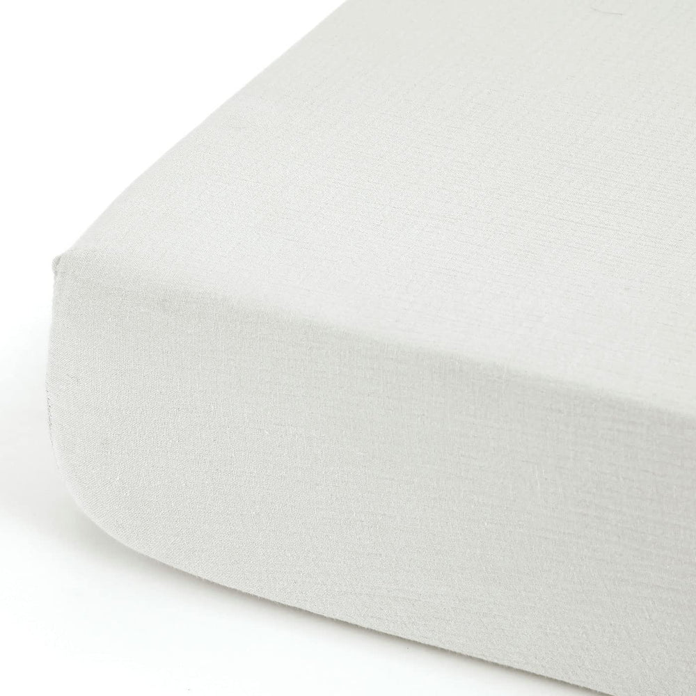GRSSDER crib-sheet-in-use on standard mattress demonstrates snug deep-pocket fit