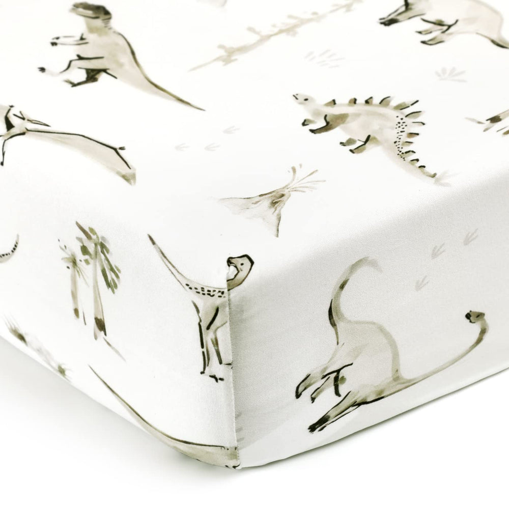 GRSSDER dinosaur-printed sheet creates a cozy bedtime scene.