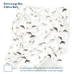 GRSSDER double-layer 34x44 swaddle blanket featured in cozy bedroom setting for all-season comfort.
