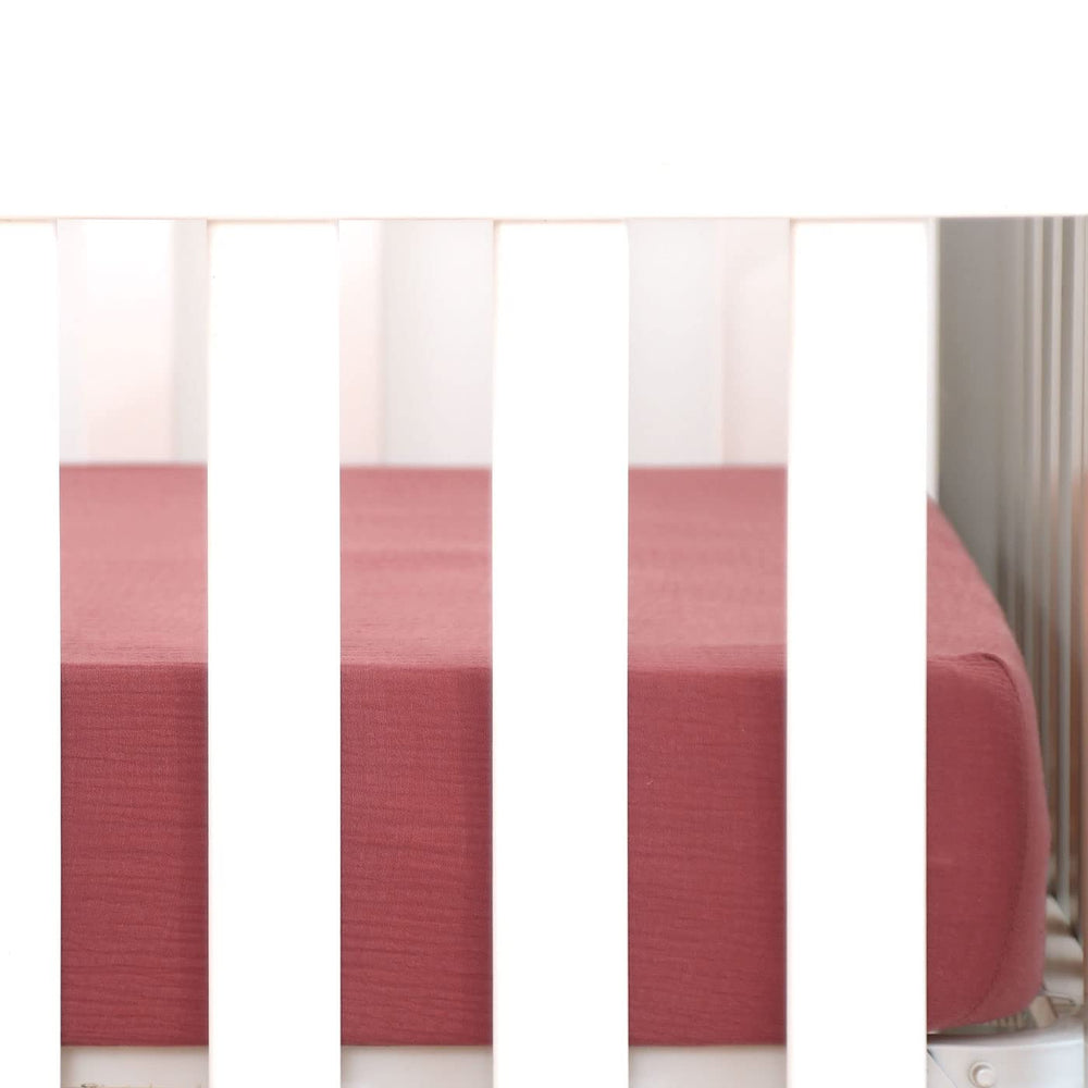 GRSSDER fitted crib sheet with elastic band for a snug, safe fit on standard mattresses.