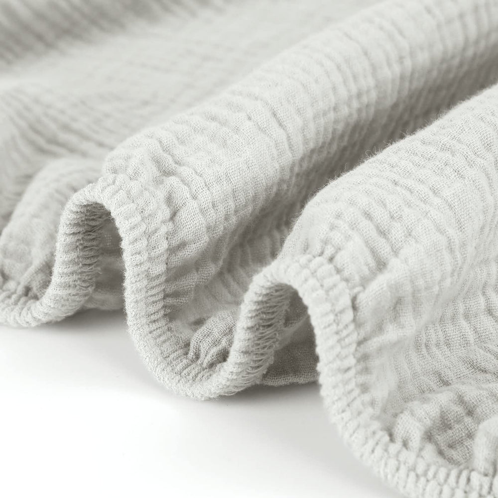 GRSSDER machine-washable crib sheet on laundry day for easy care