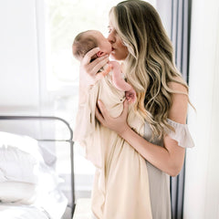 GRSSDER multi-use swaddle doubles as nursing cover and stroller shade.