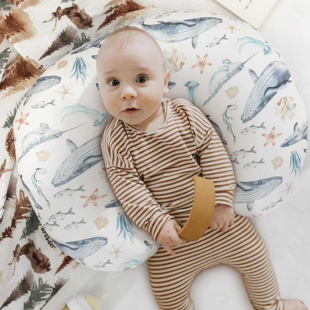 GRSSDER nursing cover fitted to curved pillows for secure, in-place feeding support.
