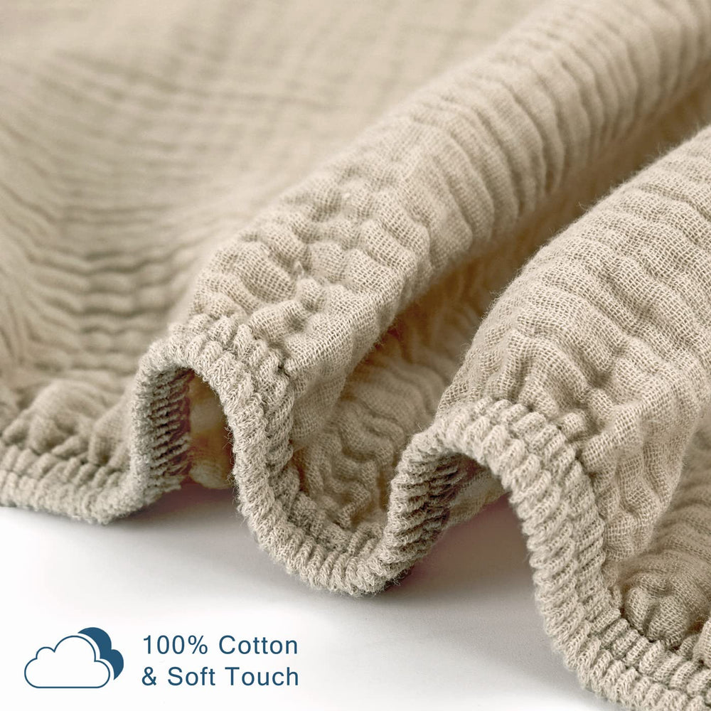 GRSSDER crib sheet being laid on mattress depicts cooling comfort.