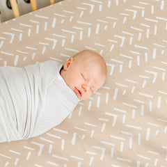 GRSSDER taupe stripe design adds gender-neutral nursery style.