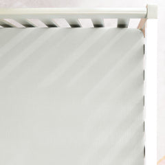 GRSSDER soft muslin crib-sheet texture close-up for gentle skin comfort