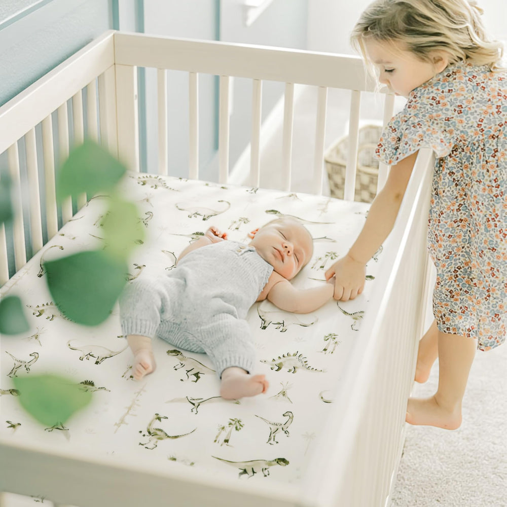 GRSSDER stretch crib sheet on mattress demonstrates easy on-off with elastic edges.