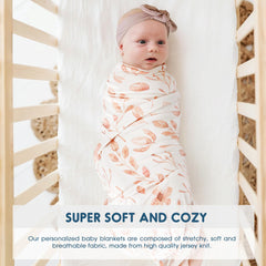 GRSSDER Pink Flora blanket in-use wrapped around baby for snug support