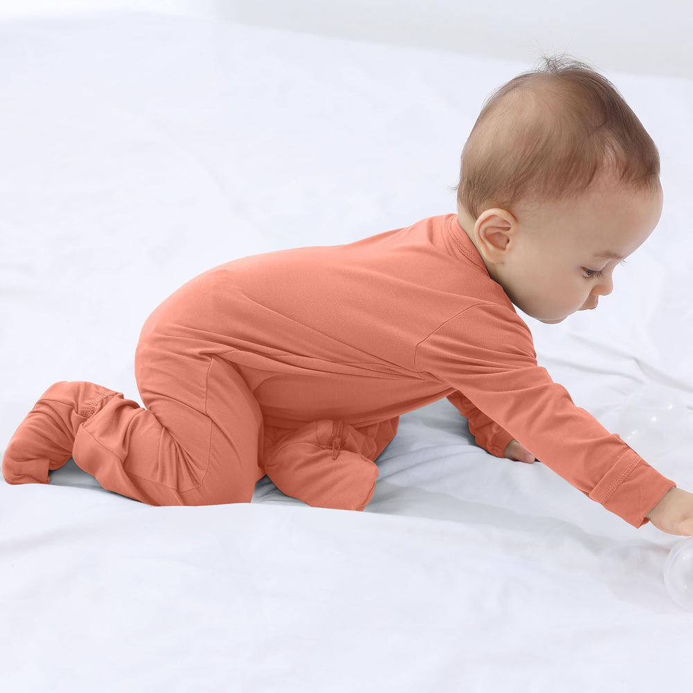 GUISBY rayon baby pajama color close-up demonstrates vibrant orange shade.