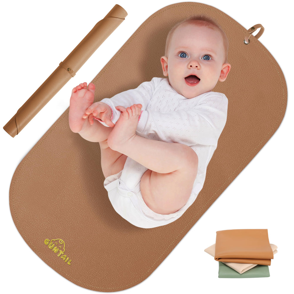 GUNTAIL portable changing mat folded with strap for easy diaper bag packing.