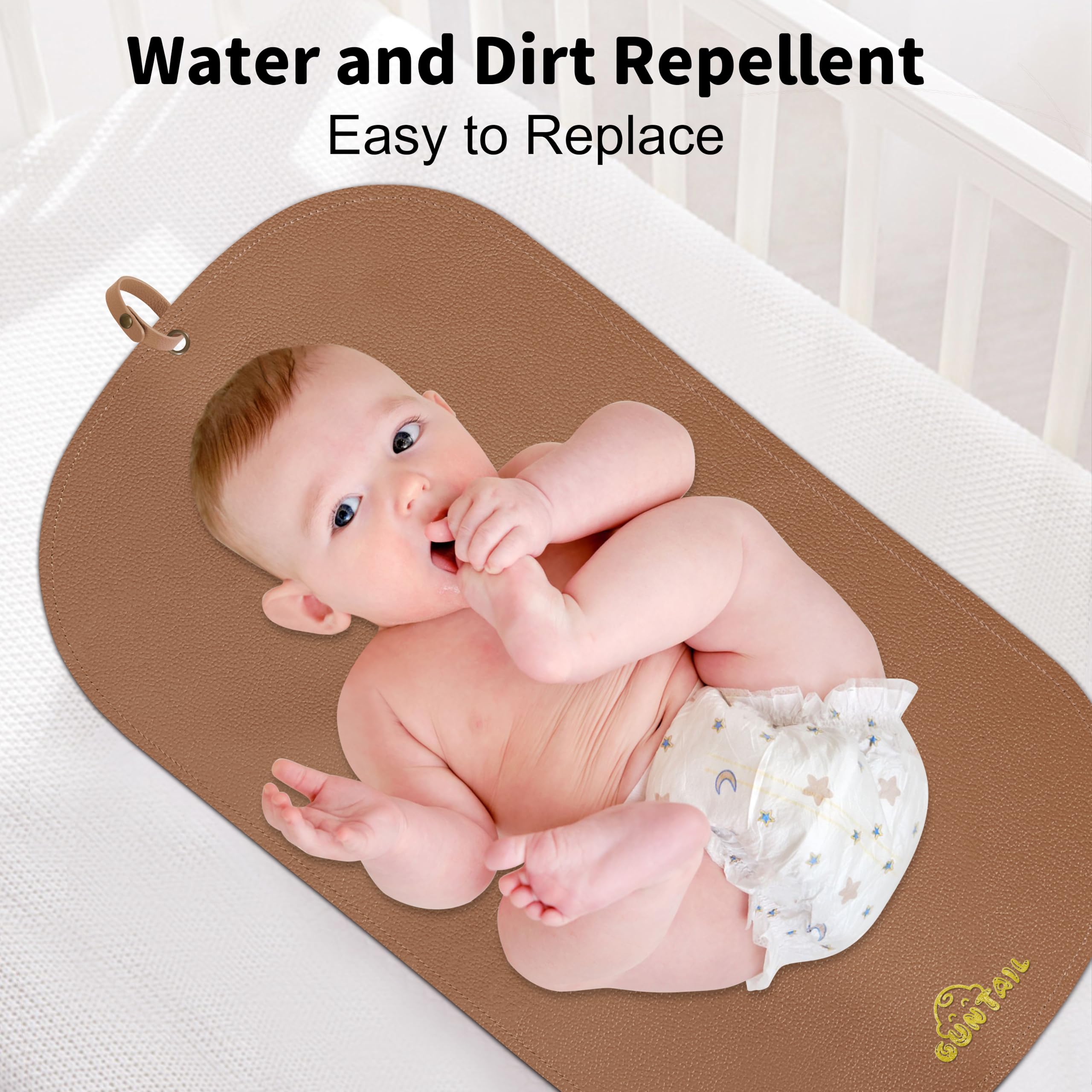 GUNTAIL changing mat opened on flat surface for quick, comfortable diaper changes.