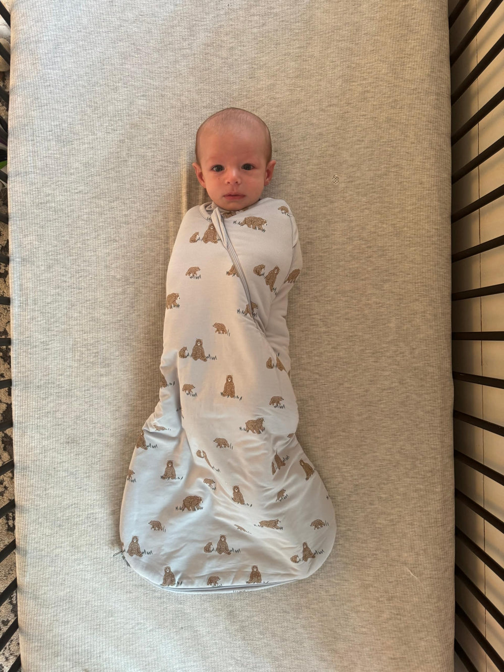 GUNAMUNA Swaddle Wrap arms-in-out design supports flexible positioning and safe transitions.