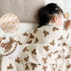 Gunnaicat muslin blanket close-up shows soft cotton texture for gentle touch