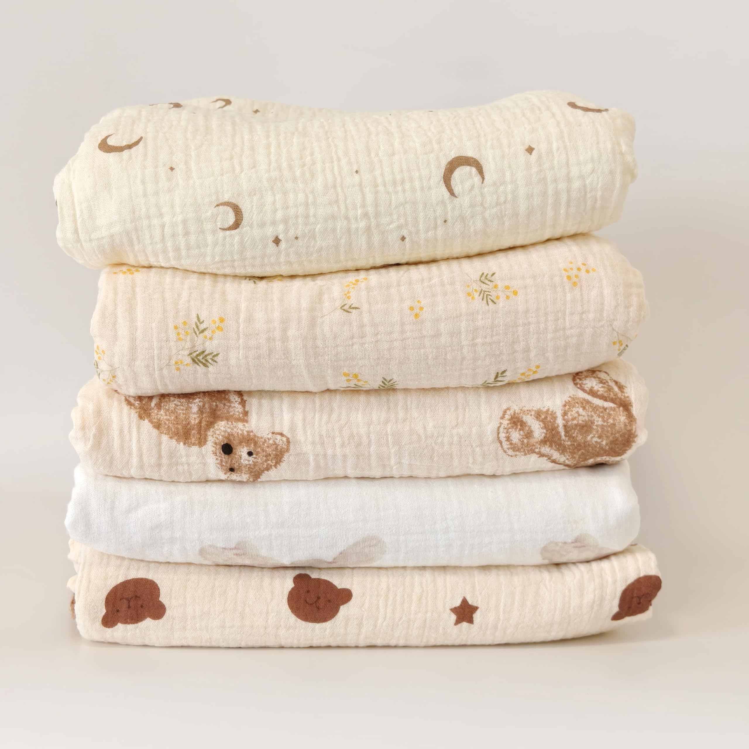 Gunnaicat blanket as stroller cover on sunny day for shade and comfort.