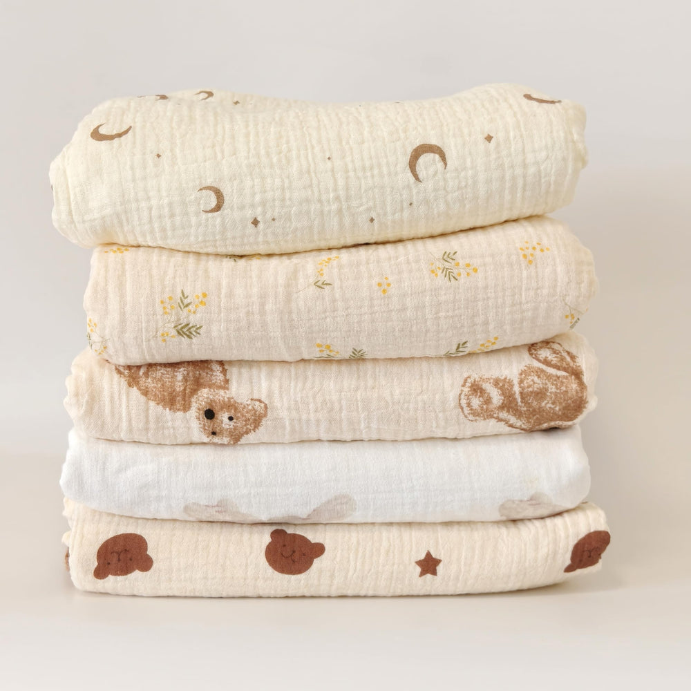 Gunnaicat blanket as stroller cover on sunny day for shade and comfort.