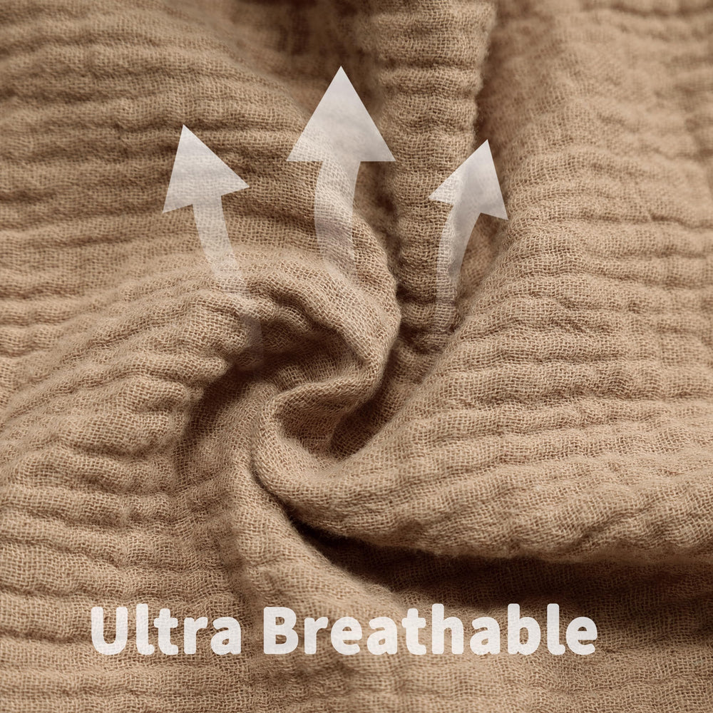 GUNTAIL crib sheets in a washing context highlighting easy-care wash.