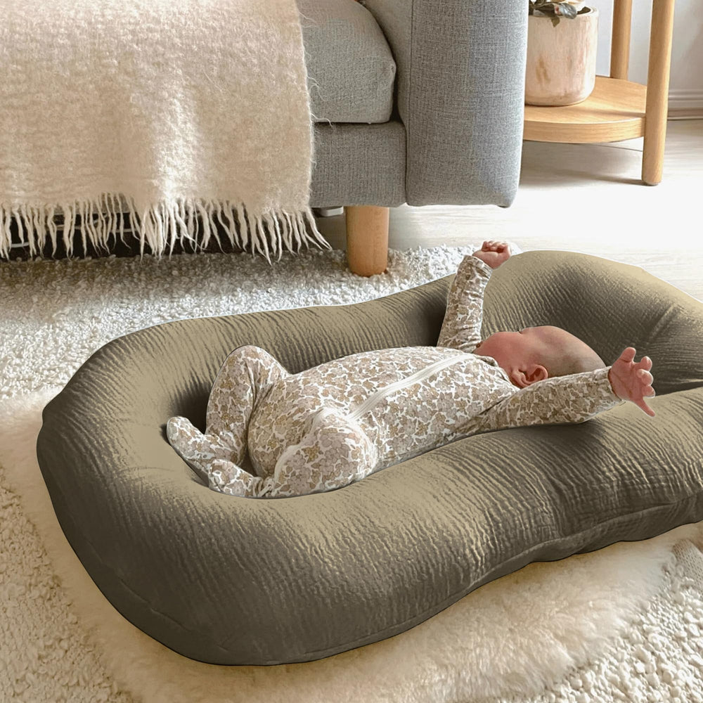 Guruixu muslin baby lounger cover closeup shows breathable fabric for comfort during naps.