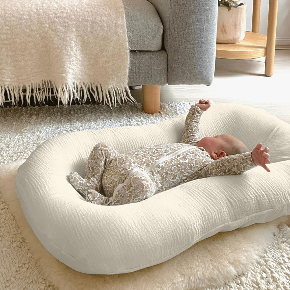 Guruixu Muslin baby lounger cover folded neatly illustrates easy care