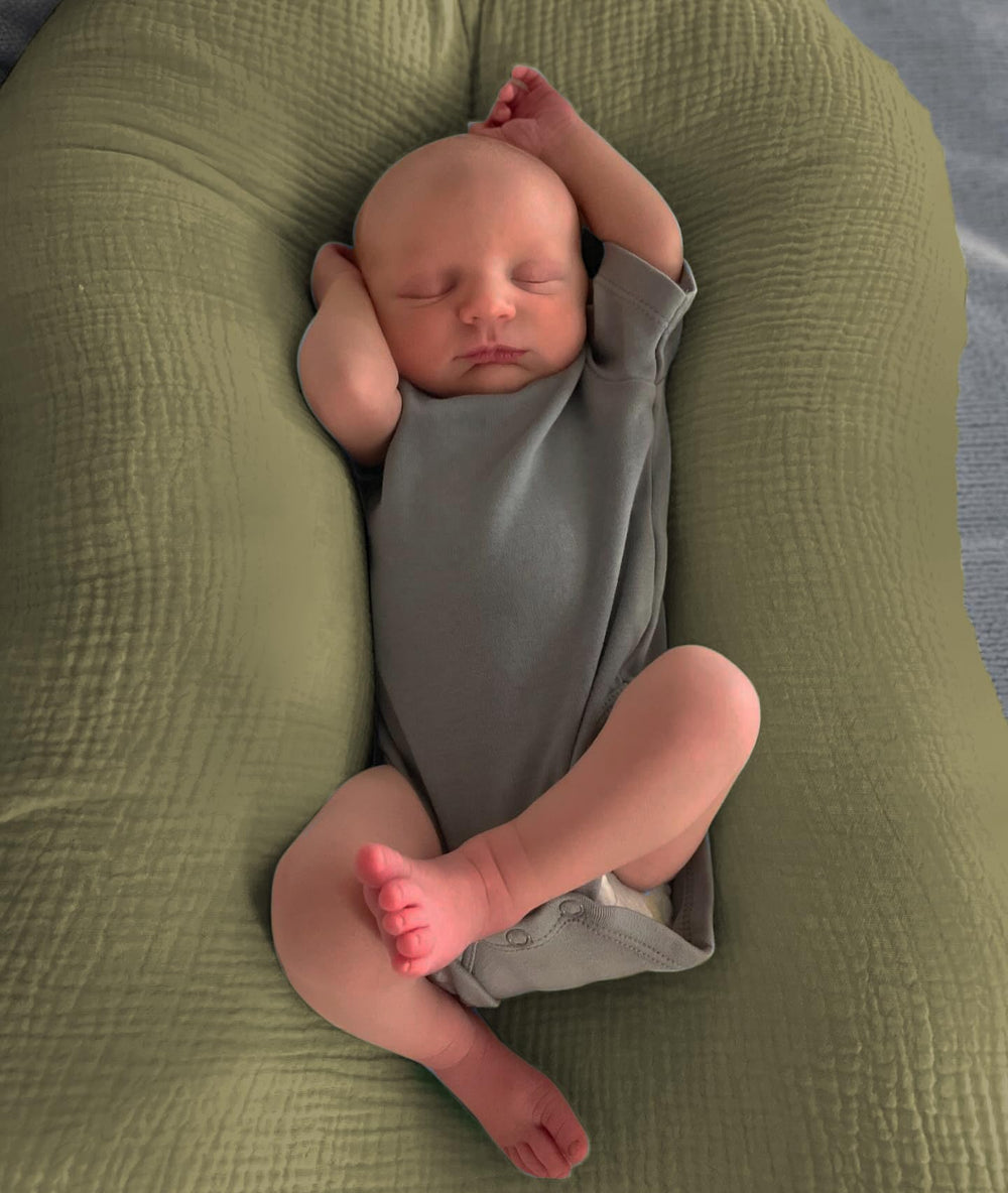 guruixu Muslin Baby Lounger Cover complements nursery decor with soft tones