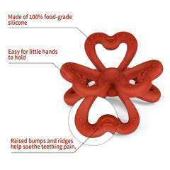 Haakaa Clover Teether copper in hand, baby-friendly chew toy for teething.