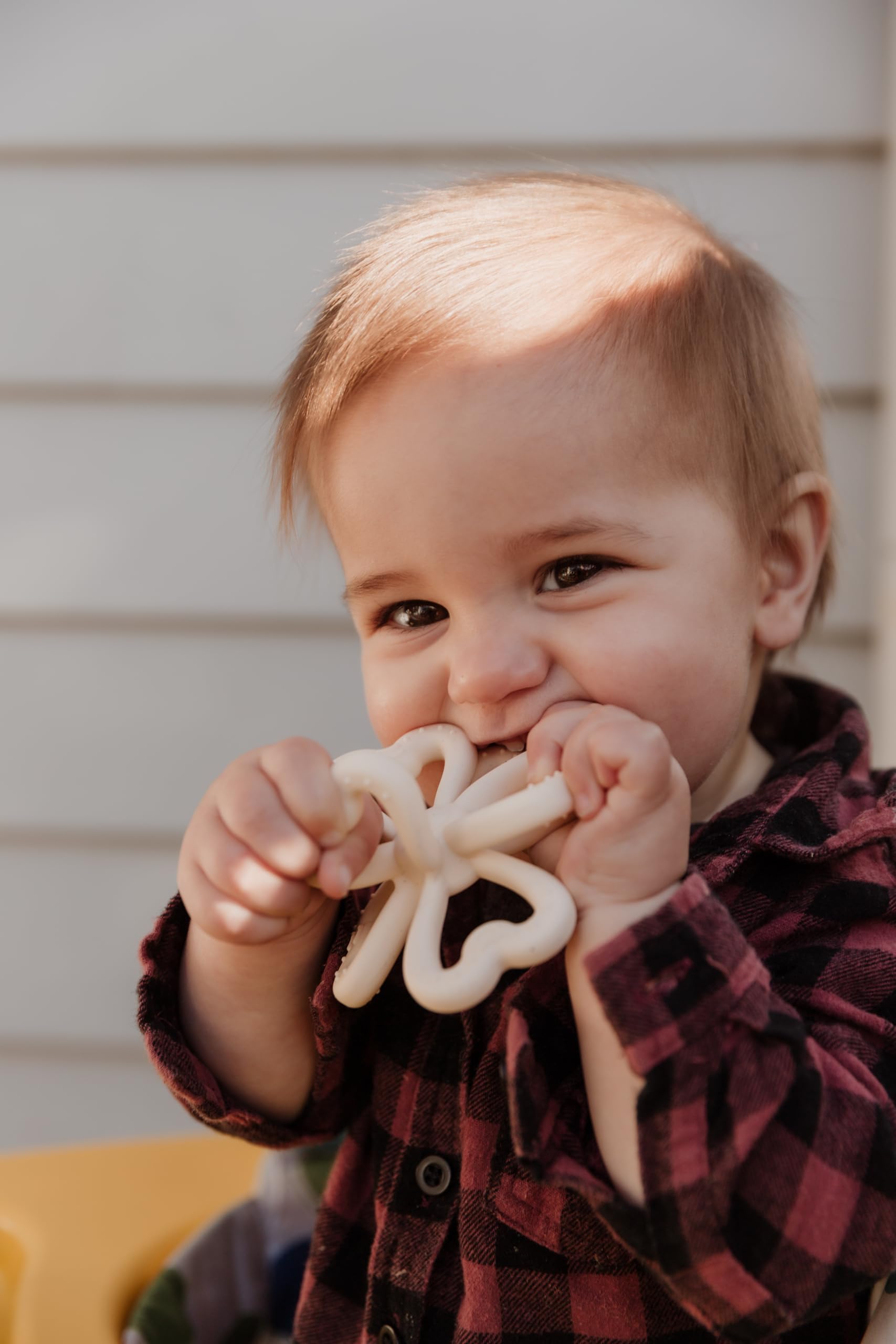 Haakaa clover teether supports sensory development through grasping and mouthing activities