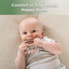 Haakaa crab teether held by small hands to spark imagination during playtime