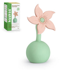 Haakaa Flower Stopper Blush seals the pump flange to prevent spills.