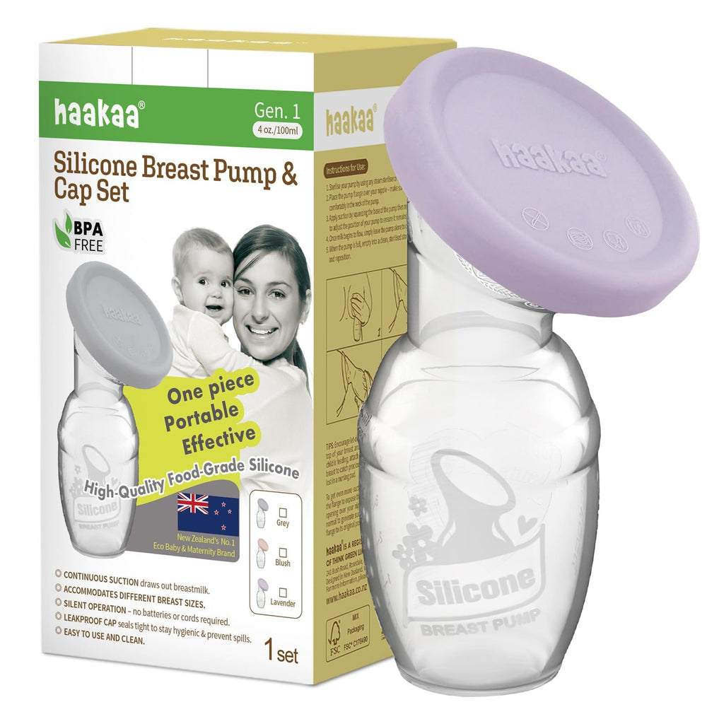 haakaa manual breast pump lavender cap closeup highlights food-grade silicone cap for clean handling