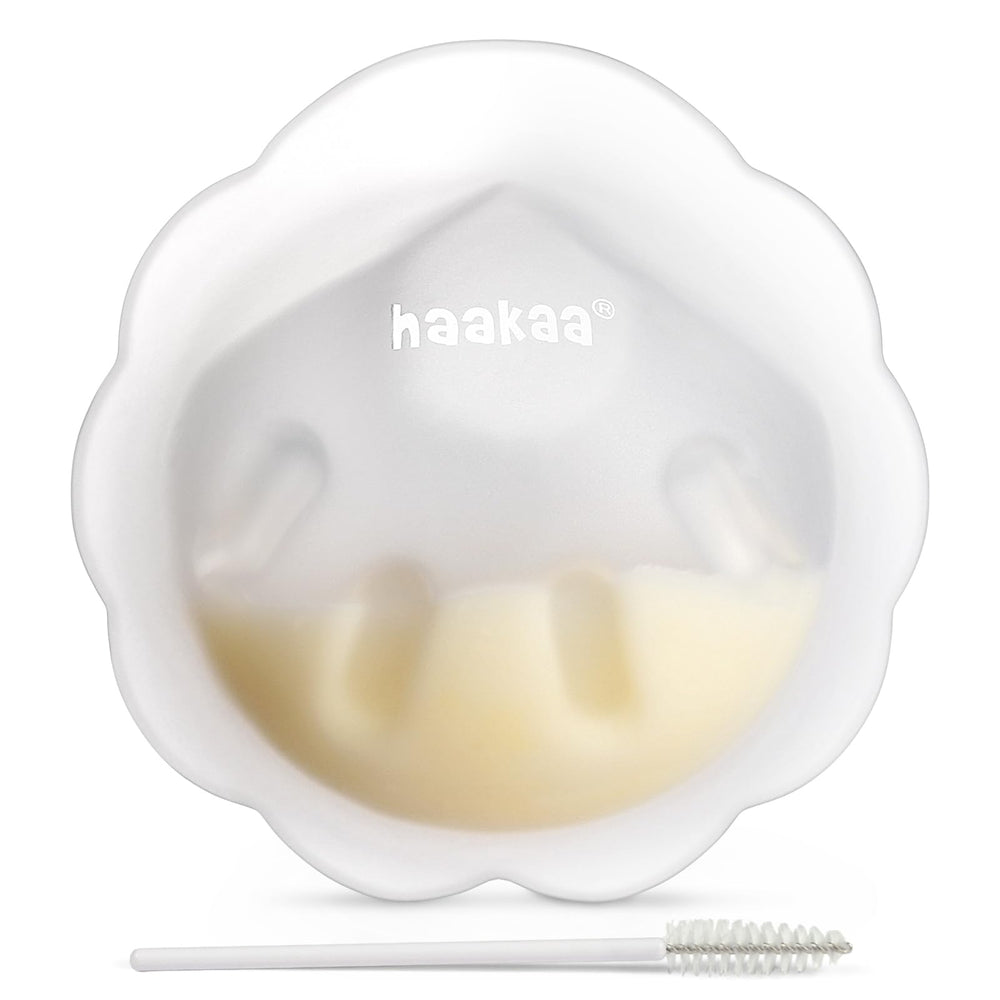 haakaa Petal Soft Milk Collector inside bra captures letdown discreetly for hands-free daily use.